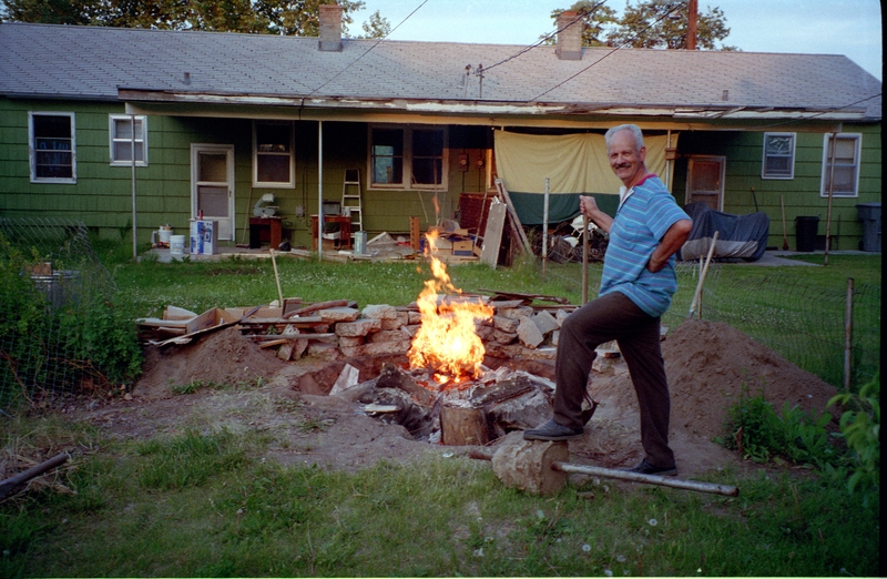 Back of 1107 Thayer, Larry burning out a sycamore stump