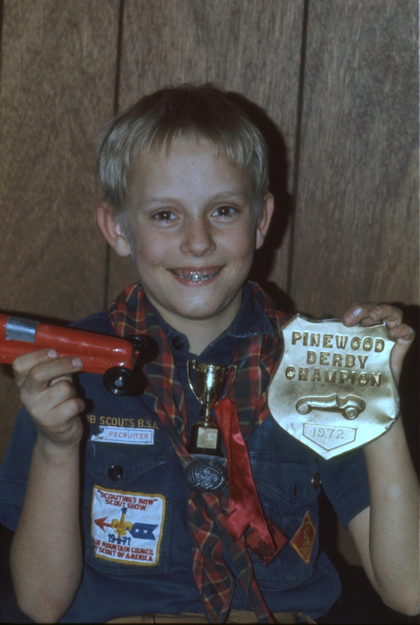 Perry Colton with Pinewood Derby car and trophy