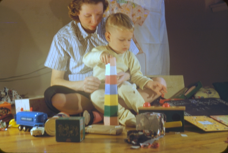 Jean and Don with tower of blocks. Christmas?