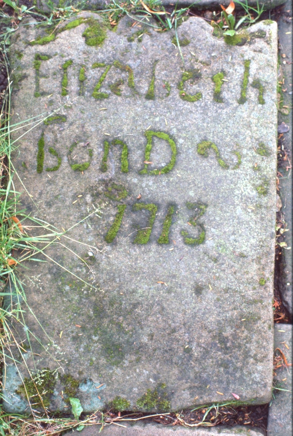 Elizabeth Bond 1713 gravestone. By virtue of the moss on the stone, gone but not forgotten.