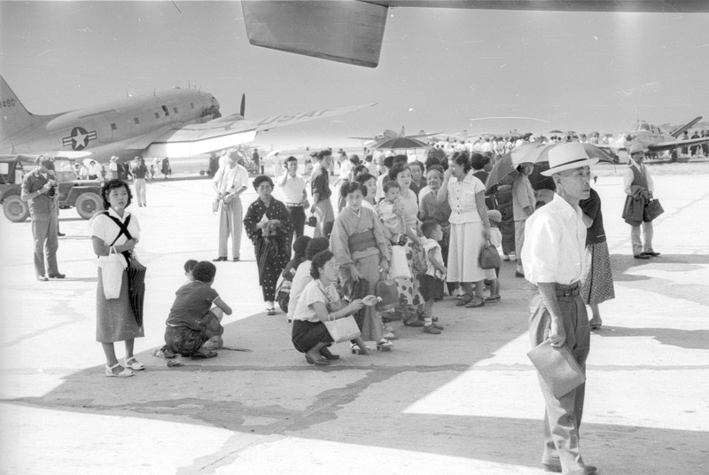 Japanese Tourists examining Display for Armed Forces Day