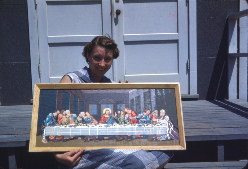 Jean Colton holding Last Supper painting