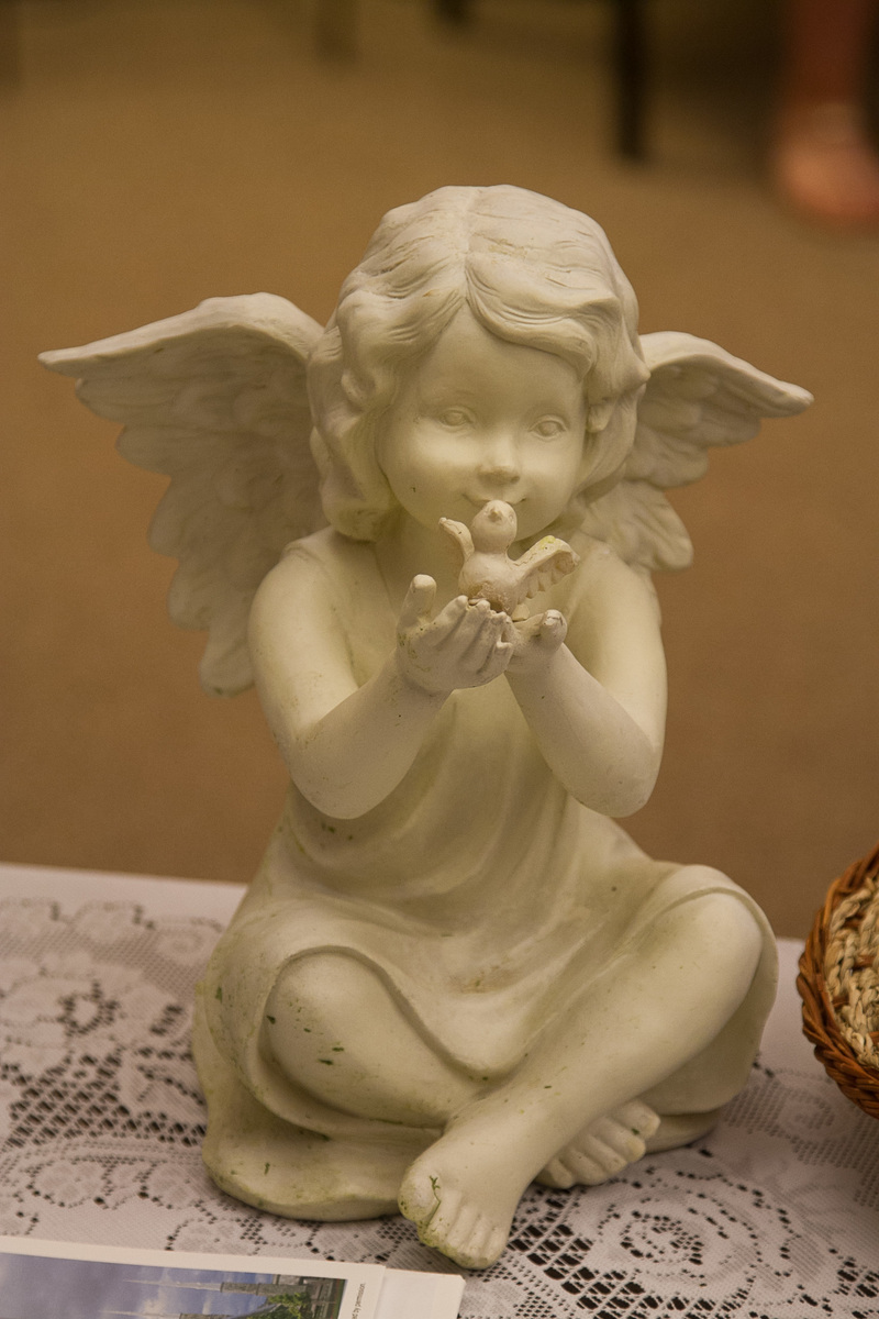 Ceramic Angel with bird.